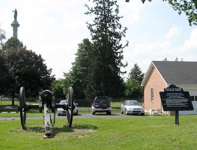 Marker showing the position of a section of the 5th New York independent Battery behind the evergreen Cemetery Gatehouse at Gettysburg