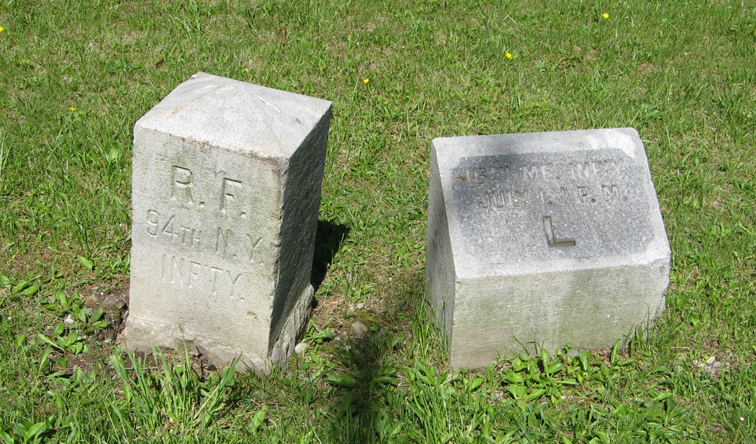 Flank markers for the 94th New York Infantry and 16th Maine Infantry on the Gettysburg battlefield.