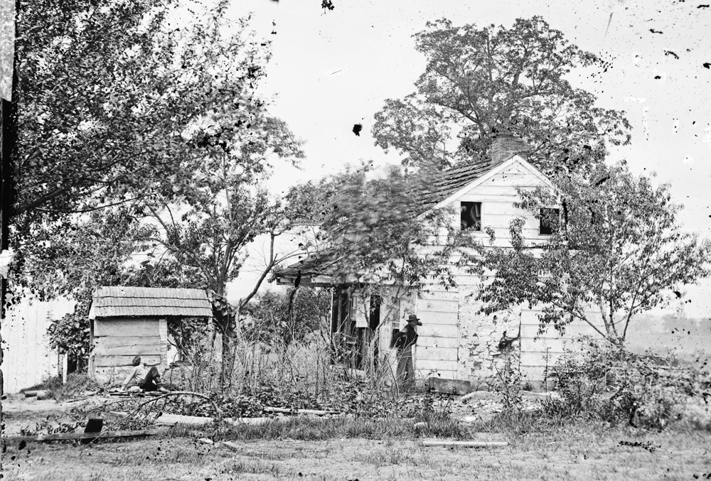The Bryan house shortly after the battle, facing southwest toward the scene of Pickett's Charge.
